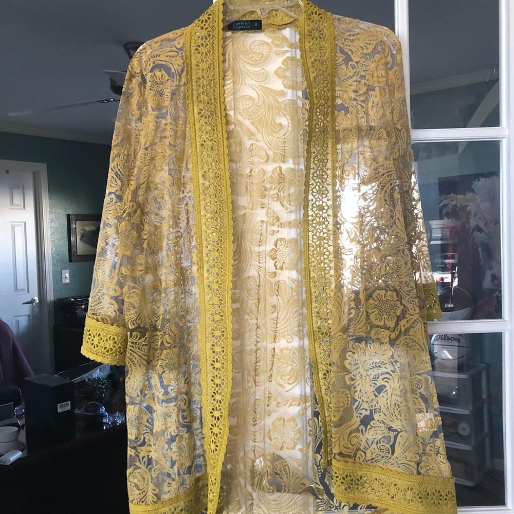 Long mustard yellow cardigan. Beautifully detailed.